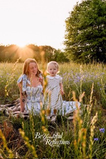 Family feet in water at golden hour